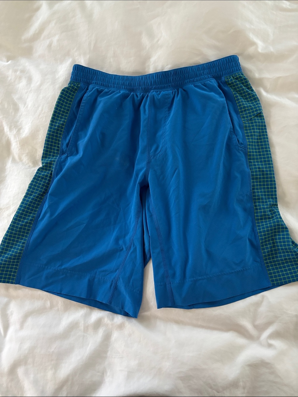 Lululemon Men's Blue Athletic Shorts with Green Grid Side Panels